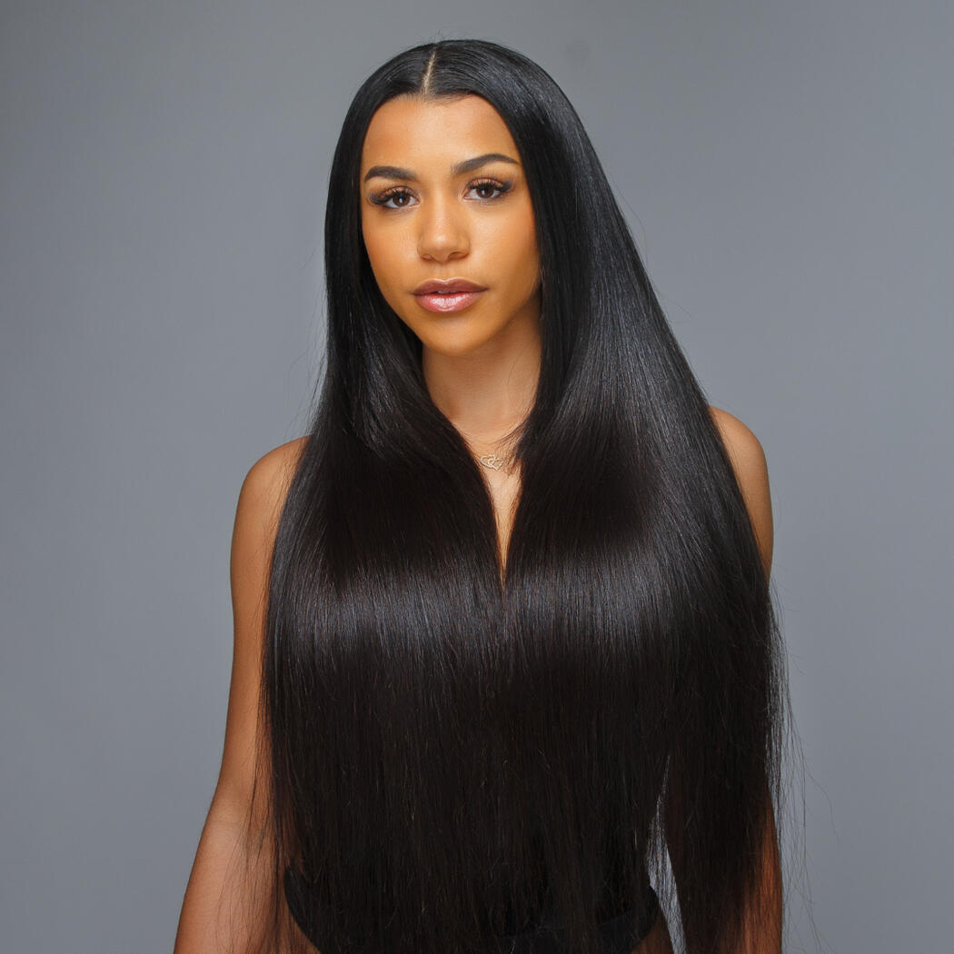 women with dark long straight hair over her chest